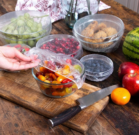 Disposable Plastic Wrap Food Covers: Elastic food lids for plates, fruit bowls etc. that eliminates the hassle of plastic wrap rolls when it comes to storage and plate saving.